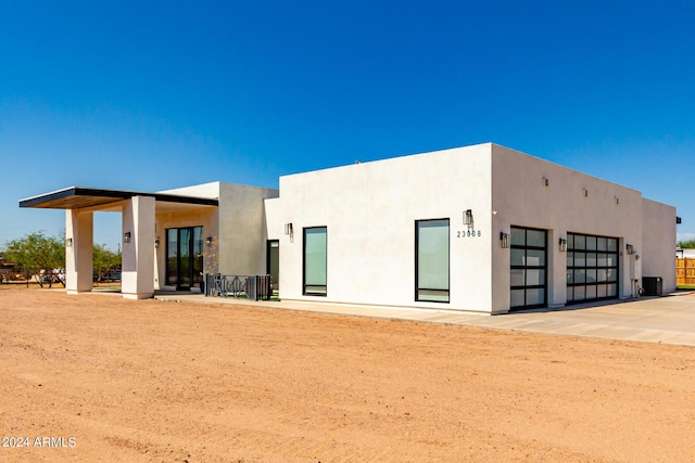 23008 E Galveston St, Mesa, AZ 85212 - rear view of property with central AC, driveway, and stucco siding