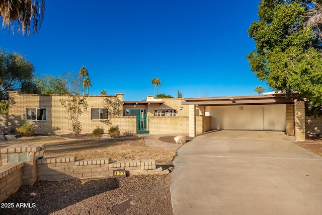 view of front of home featuring a carport