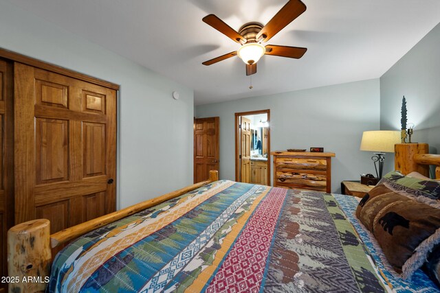 bedroom with ensuite bathroom and ceiling fan