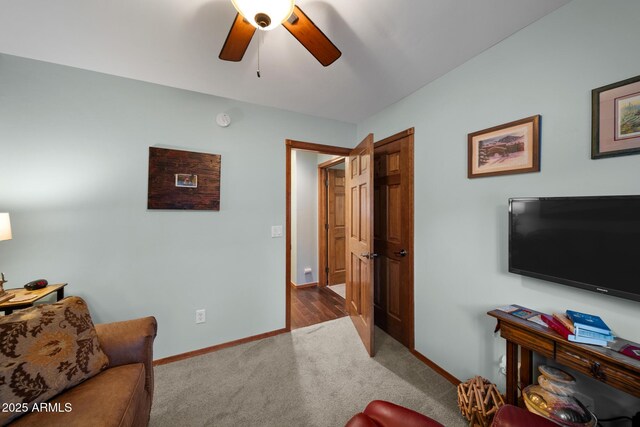 living room with carpet flooring and ceiling fan