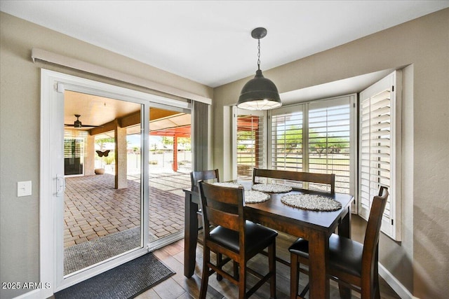 dining room featuring ceiling fan and wood finished floors