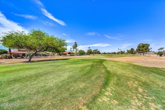 view of home's community featuring a lawn