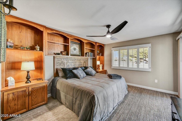 carpeted bedroom featuring baseboards and ceiling fan