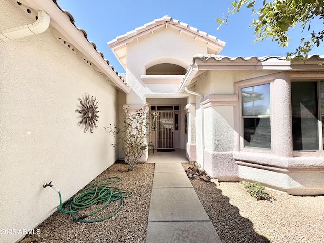 doorway to property with stucco siding