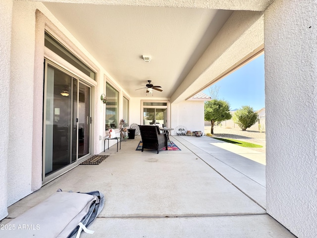 view of patio / terrace featuring a ceiling fan