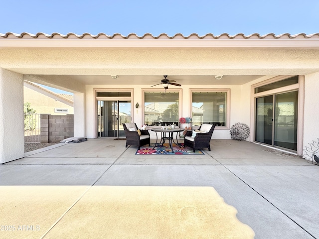 view of patio / terrace featuring outdoor dining area and ceiling fan