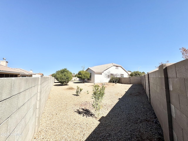 view of yard with a fenced backyard