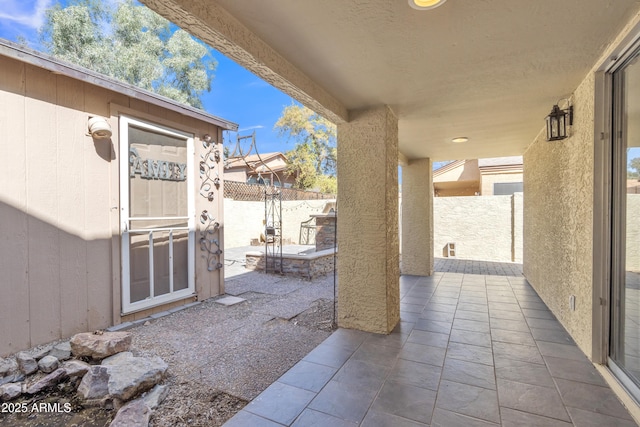 view of patio / terrace with fence