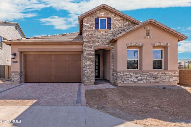 view of front of property featuring a garage