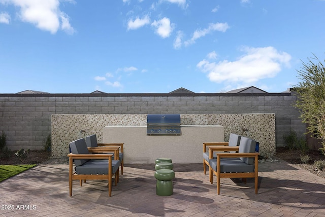 24223 W Illini St, Buckeye, AZ 85326 - view of patio featuring an outdoor kitchen