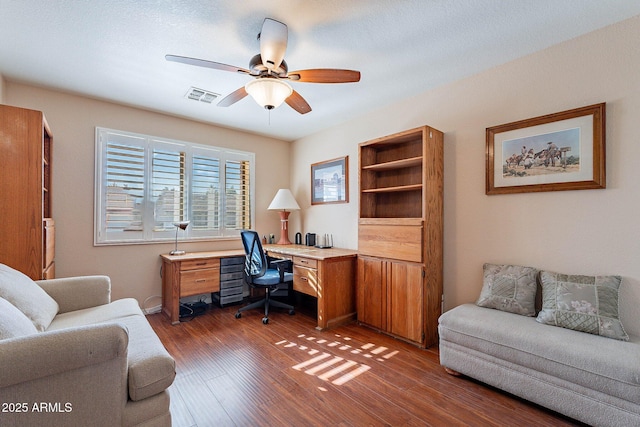 office area featuring ceiling fan and dark hardwood / wood-style flooring