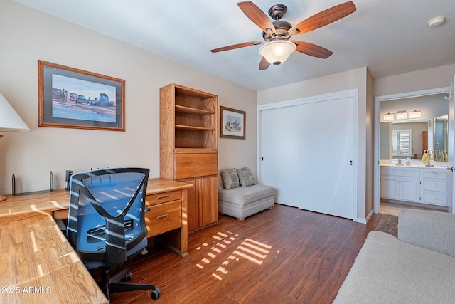 office featuring dark hardwood / wood-style flooring and ceiling fan