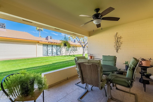 sunroom / solarium with plenty of natural light and ceiling fan