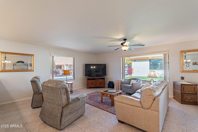 tiled living room featuring ceiling fan