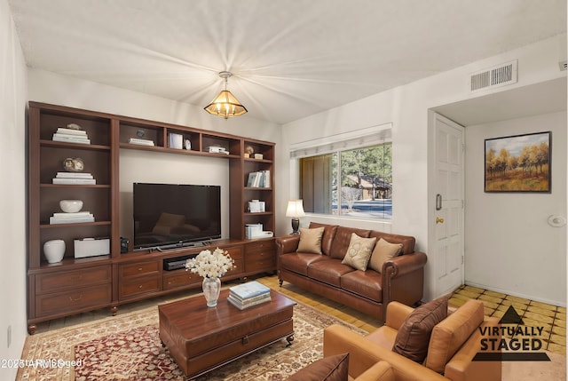 living room with an inviting chandelier