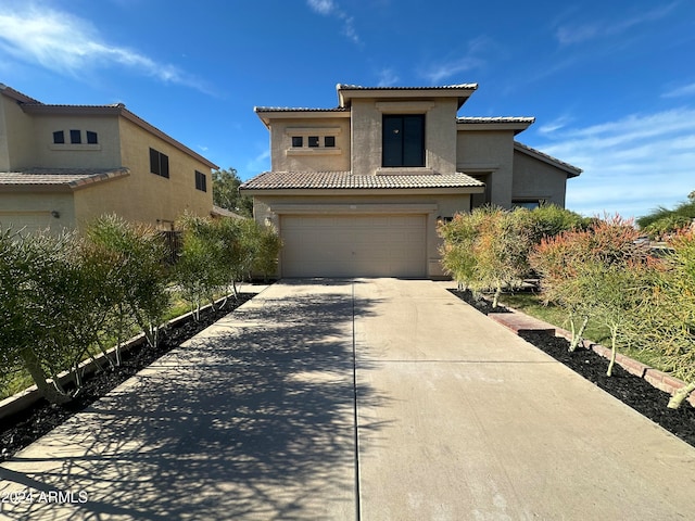 mediterranean / spanish-style house featuring a garage