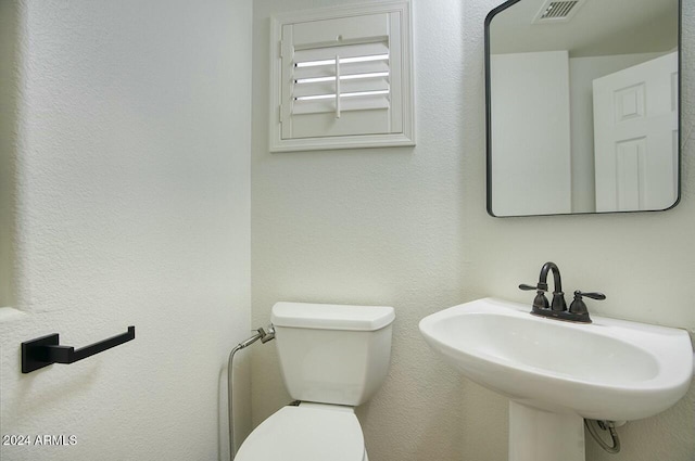 bathroom featuring sink and toilet