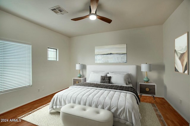 bedroom featuring hardwood / wood-style flooring and ceiling fan