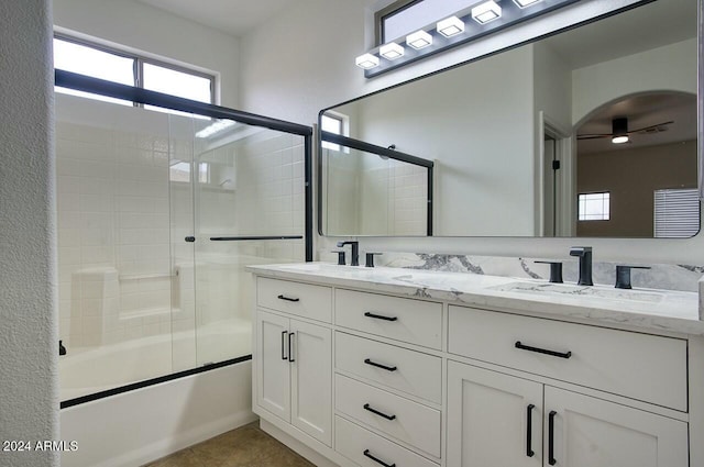 bathroom featuring ceiling fan, vanity, and combined bath / shower with glass door