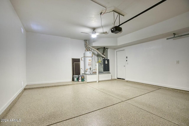 garage featuring ceiling fan, gas water heater, a garage door opener, and heating unit