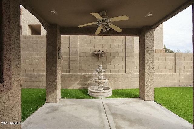 view of patio featuring ceiling fan