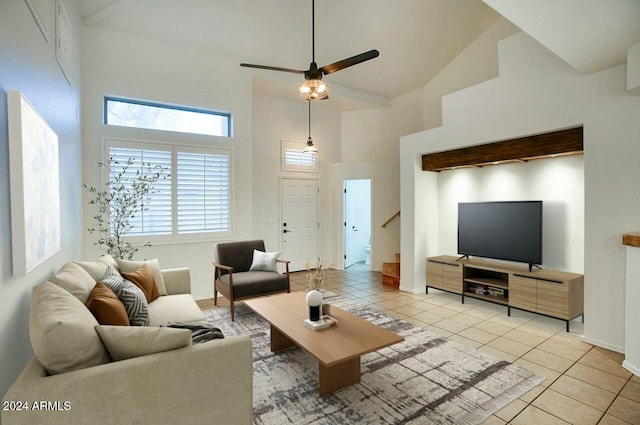 living room featuring ceiling fan, light tile patterned flooring, and high vaulted ceiling