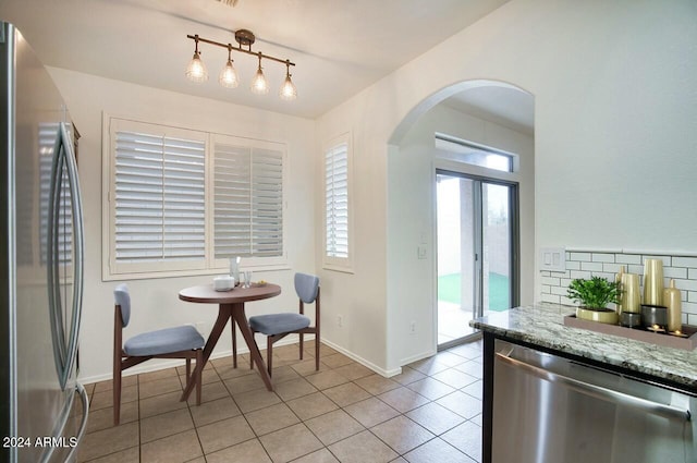 dining room featuring light tile patterned flooring