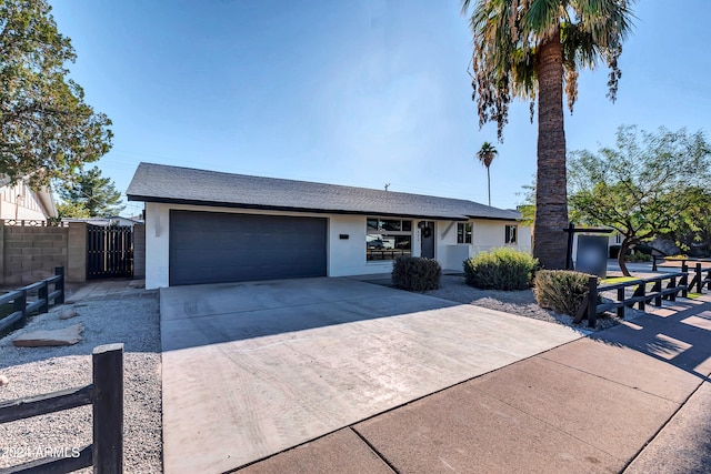 ranch-style house featuring a garage