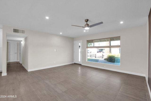 unfurnished room featuring ceiling fan