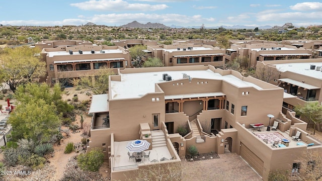 drone / aerial view with a residential view and a mountain view