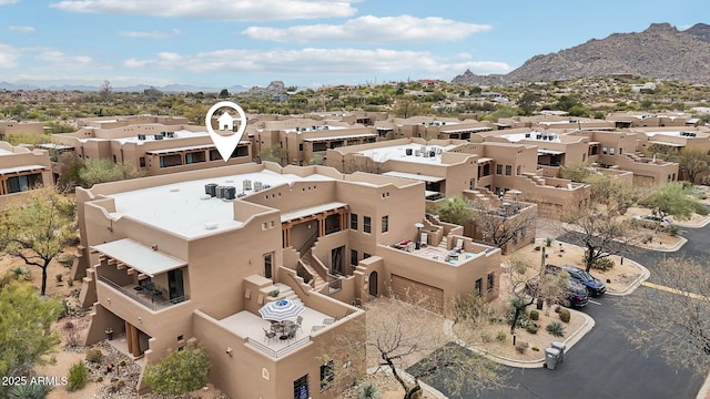 birds eye view of property featuring a residential view and a mountain view