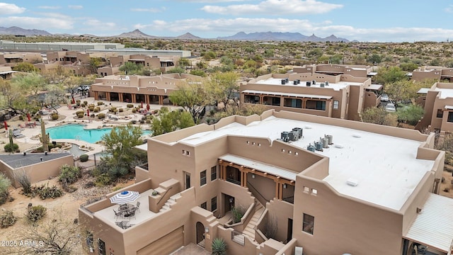 birds eye view of property with a residential view and a mountain view