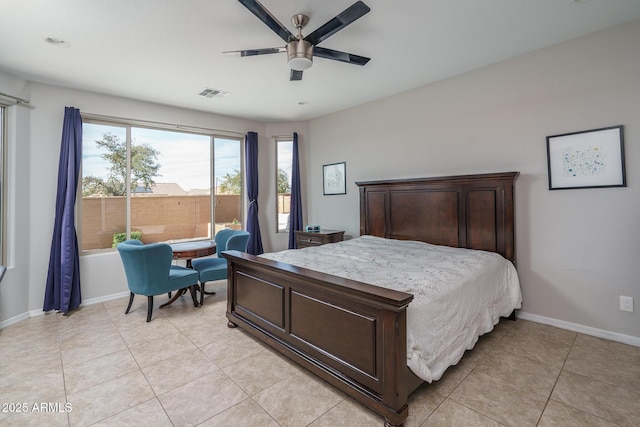 tiled bedroom featuring ceiling fan