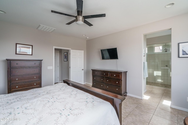 bedroom with light tile patterned flooring, connected bathroom, and ceiling fan