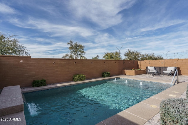 view of pool with pool water feature and a patio