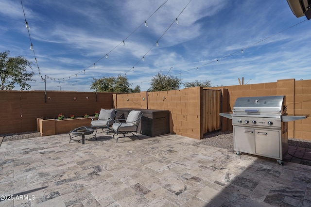 view of patio / terrace with an outdoor fire pit