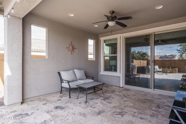 view of patio featuring ceiling fan and outdoor lounge area