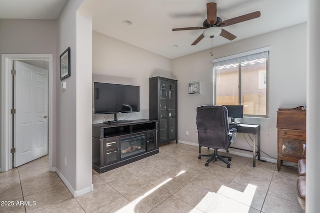 office featuring light tile patterned flooring and ceiling fan