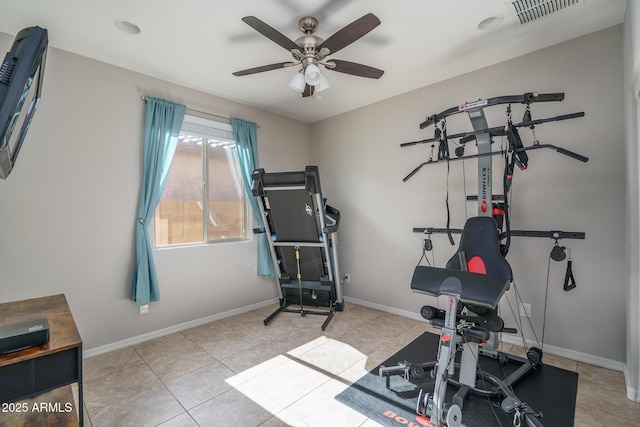 workout room with light tile patterned floors and ceiling fan