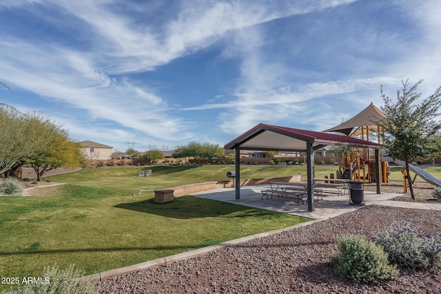 view of property's community featuring a playground and a yard