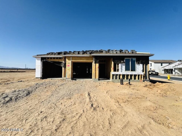 unfinished property with a garage