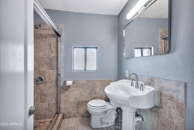 bathroom with toilet and walk in shower