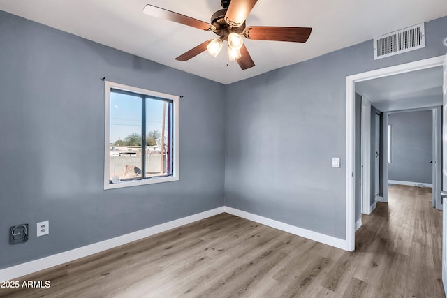 spare room with ceiling fan and light hardwood / wood-style flooring