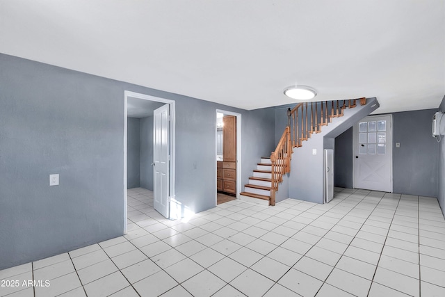 spare room featuring light tile patterned flooring