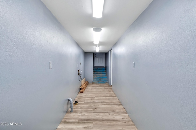 corridor with light wood-type flooring