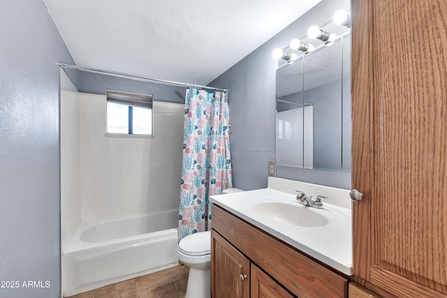 full bathroom featuring toilet, vanity, tile patterned flooring, and shower / bath combo