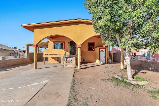 view of front of property with a patio