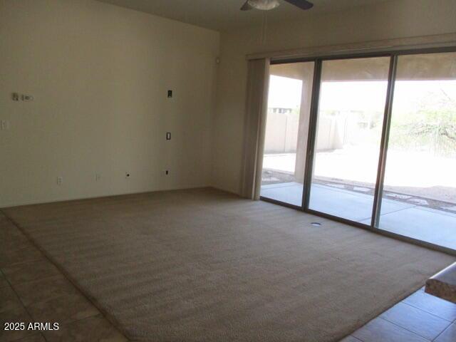 32020 N 23rd Ave, Phoenix, AZ 85085 - carpeted spare room featuring ceiling fan and tile patterned floors
