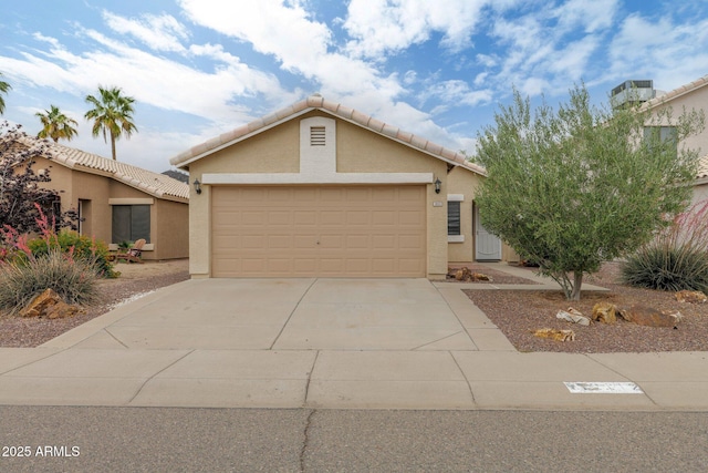 2112 E Donald Dr, Phoenix, AZ 85024 - view of front of property with stucco siding, driveway, an attached garage, and a tiled roof