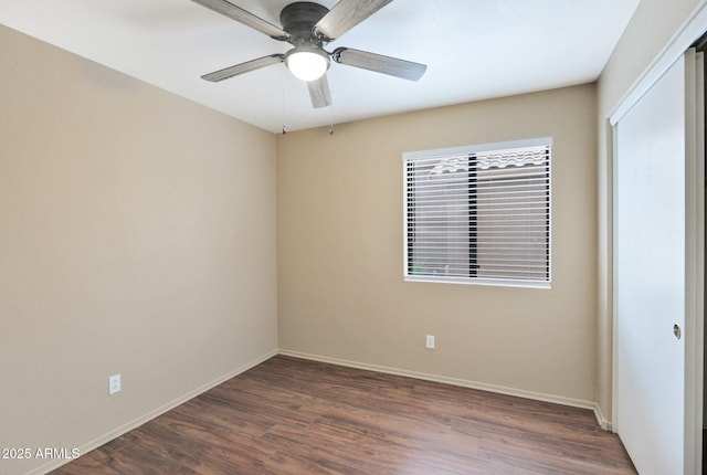 2112 E Donald Dr, Phoenix, AZ 85024 - empty room featuring dark wood finished floors, baseboards, and a ceiling fan